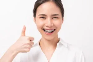 smiling asian woman and showing thumbs up or like 2021 09 01 18 14 37 utc 1