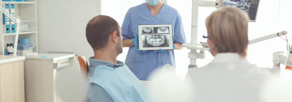 orthodontist-nurse-holding-digital-tablet-with-too-2021-10-27-20-25-17-utc (1)